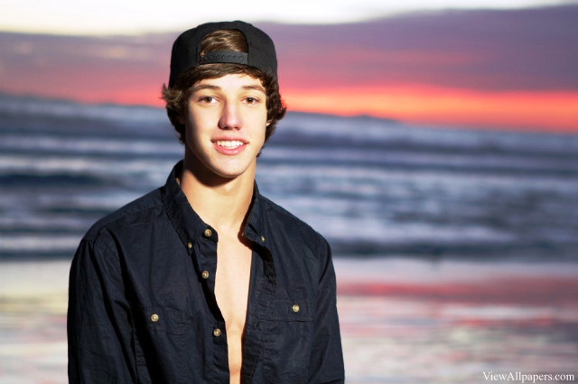 Young man hat ocean sunset free wallpaper - medium preview image