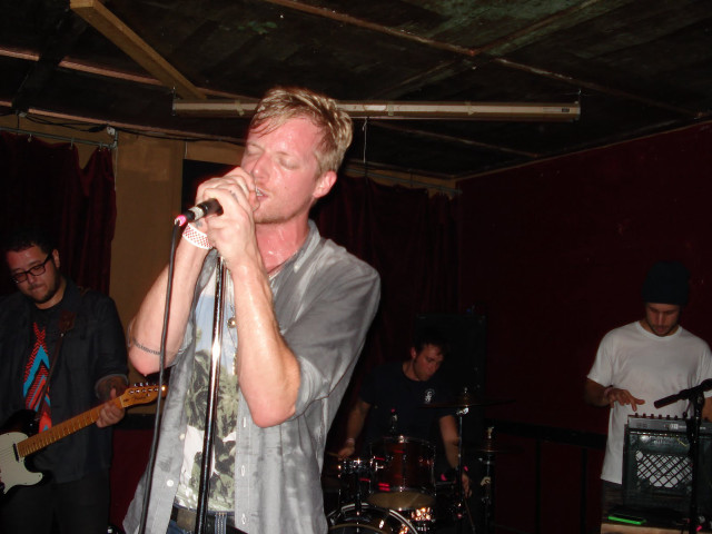 Man singing microphone band stage free wallpaper - medium preview image