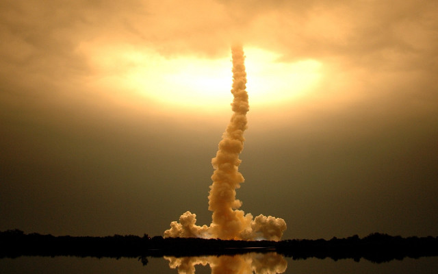 Tall tower smoke sun background free wallpaper - medium preview image