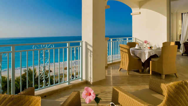 Balcony wicker furniture ocean view free wallpaper - medium preview image