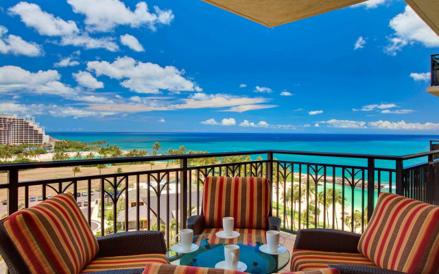 Balcony table chairs ocean view free wallpaper - medium preview image
