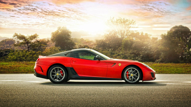 Red sports car forest sunset free wallpaper for desktop - medium preview image