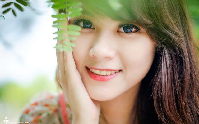 Woman blue eyes green leaf #4 free wallpaper - medium preview image