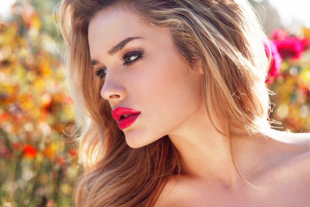 Woman longhair redlipstick flowerfield blurry free wallpaper - medium preview image