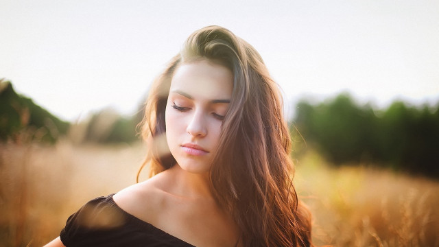 Woman field grass cellphone serious free wallpaper - medium preview image