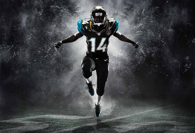 Football player running field uniform free wallpaper - medium preview image