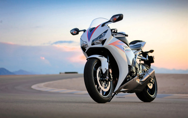 White motorcycle parked track sunset free wallpaper - medium preview image