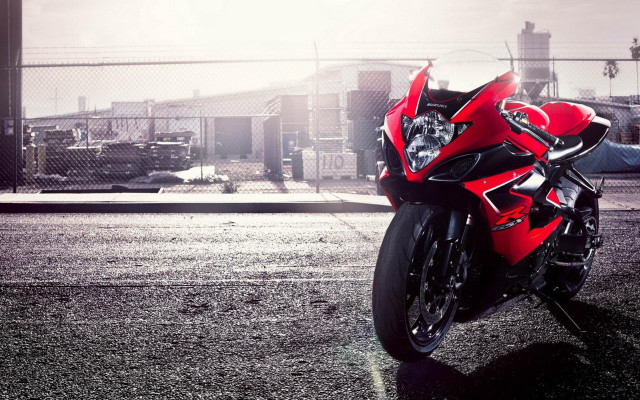 Red motorcycle parking lot fence free wallpaper - medium preview image