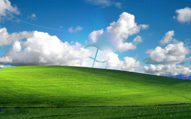 Green field cross blue sky free wallpaper - medium preview image