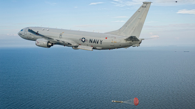 Military plane ocean parachute landing free wallpaper - medium preview image