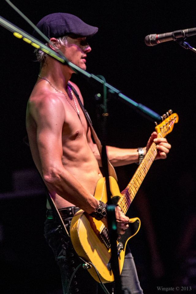 Shirtless man playing guitar singing free wallpaper - medium preview image