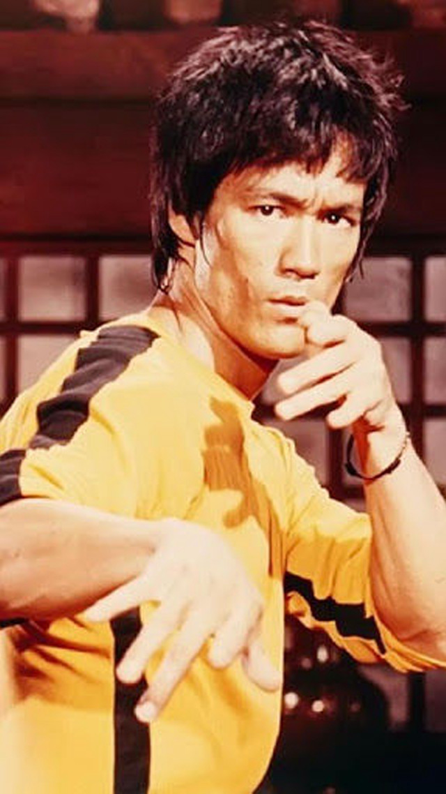 Man yellow shirt serious hand free wallpaper - medium preview image