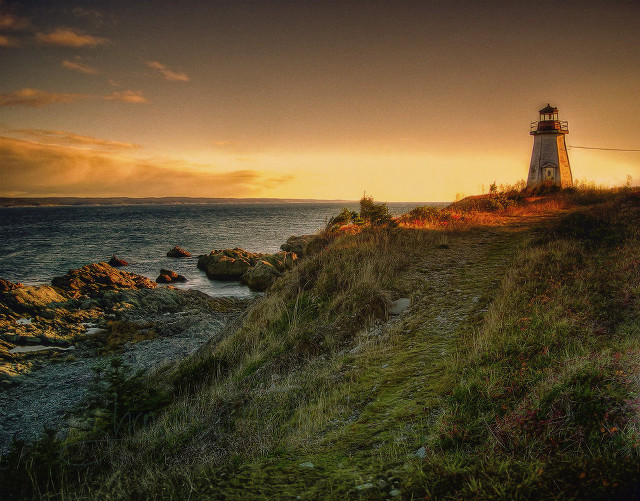 Lighthouse cliff ocean sunset sunrise free wallpaper - medium preview image