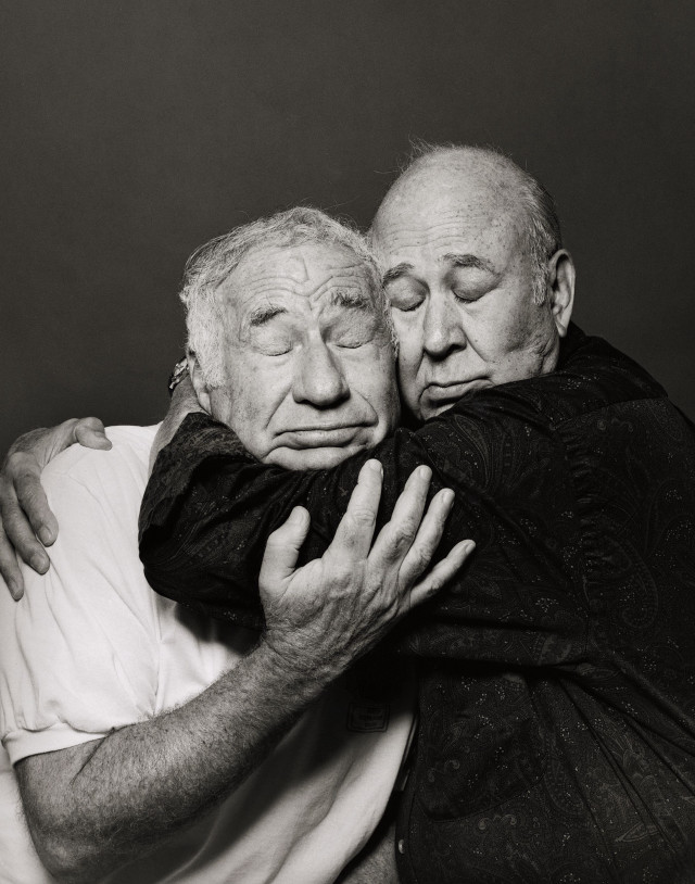 Elderly men hugging black white free wallpaper - medium preview image