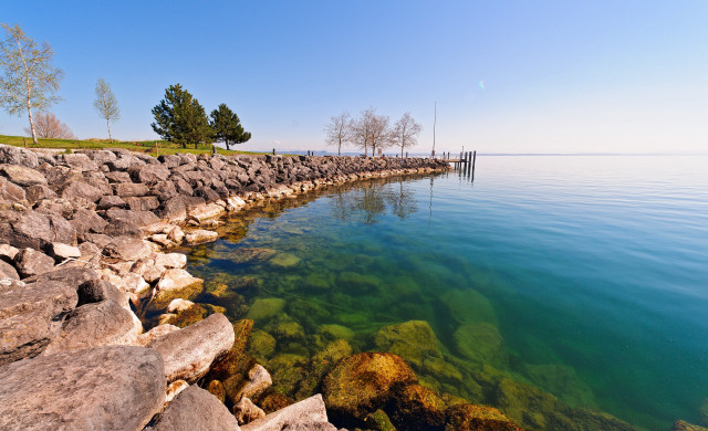 Water rocks dock grassy area free wallpaper - medium preview image