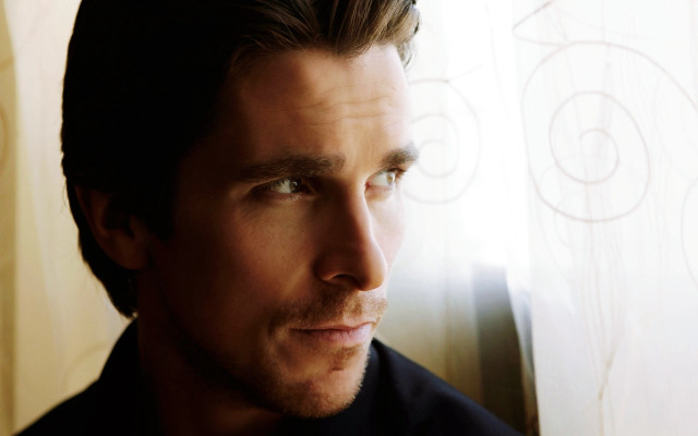 Man looking out window serious free wallpaper - medium preview image