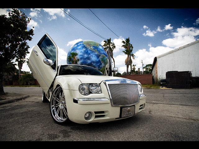 White car globe hood parked free wallpaper - medium preview image