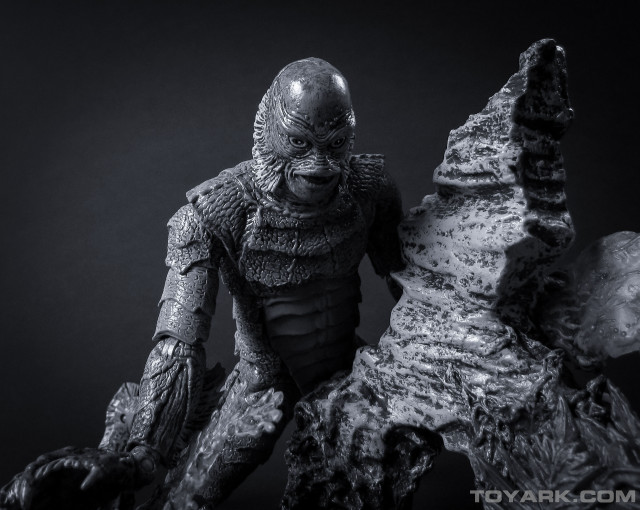 Creature statue holding rock large free wallpaper - medium preview image