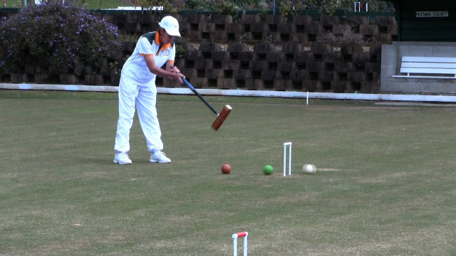 Person hitting ball bat tee free wallpaper - medium preview image
