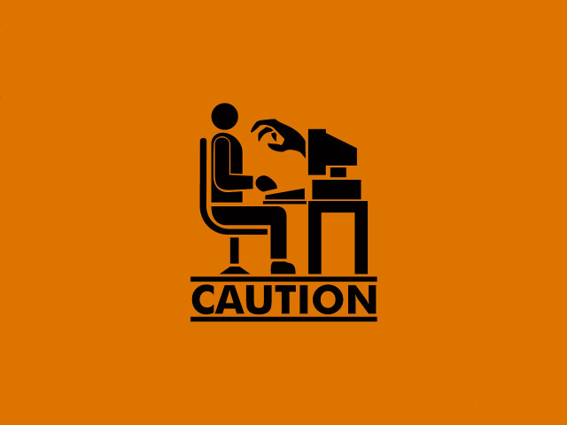 Man sitting desk computer caution free wallpaper - medium preview image