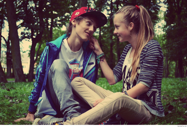 Boy girl sitting ground talking free wallpaper - medium preview image