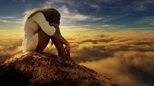 Woman sitting rock clouds head free wallpaper - medium preview image