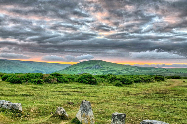 Grassy field rocks mountain cloudy free wallpaper - medium preview image
