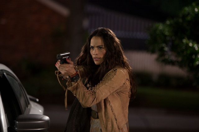 Woman holding gun looking camera free wallpaper - medium preview image