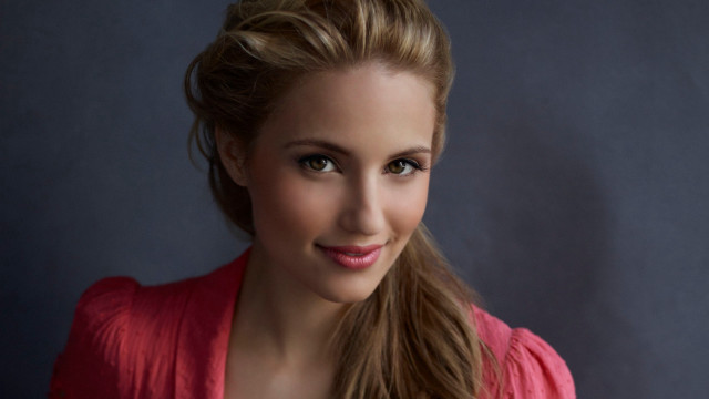 Woman ponytail pinkshirt smile bluebackdrop free wallpaper - medium preview image