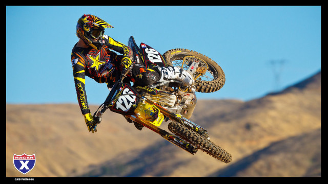 Motorcycle trick air hillside mountains free wallpaper - medium preview image