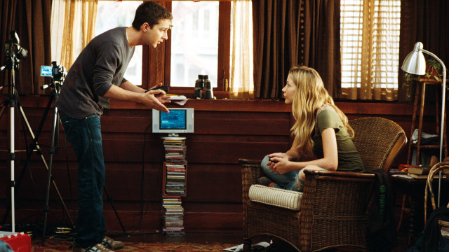 Man woman chair room books free wallpaper - medium preview image