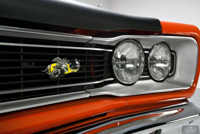 Car grille yellow logo closeup free wallpaper - medium preview image