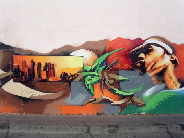 Mural man hat cigarette cityscape free wallpaper - medium preview image