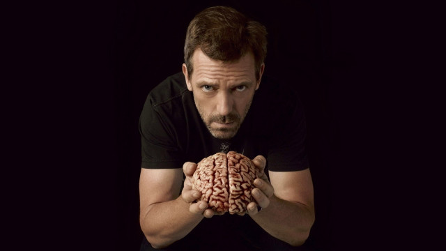 Man holding brain black background #3 free wallpaper - medium preview image