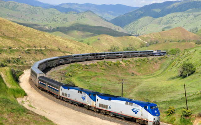 Train mountainside city traveling tracks free wallpaper - medium preview image