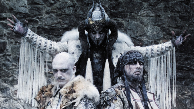 Costumed men stone wall waterfall free wallpaper - medium preview image