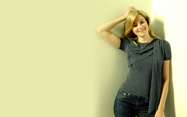 Woman leaning wall hand head #6 free wallpaper - medium preview image