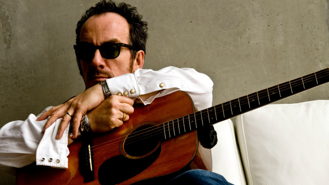 Man couch guitar sunglasses white free wallpaper - medium preview image