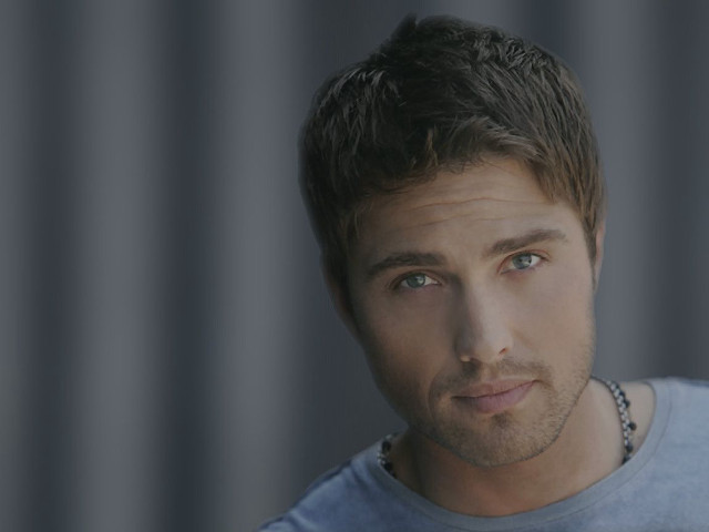 Man blue shirt necklace serious free wallpaper - medium preview image