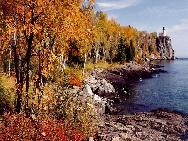 Lighthouse rocky shore autumn impressionist free wallpaper - medium preview image
