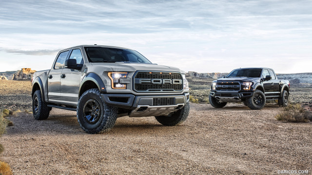 Trucks parked dirt road desert free wallpaper - medium preview image