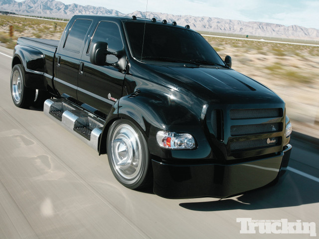 Black truck highway mountains trees free wallpaper - medium preview image