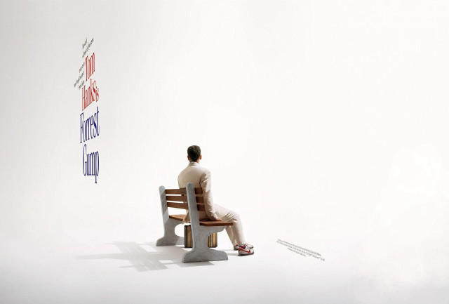 Man sitting bench sign reads free wallpaper - medium preview image