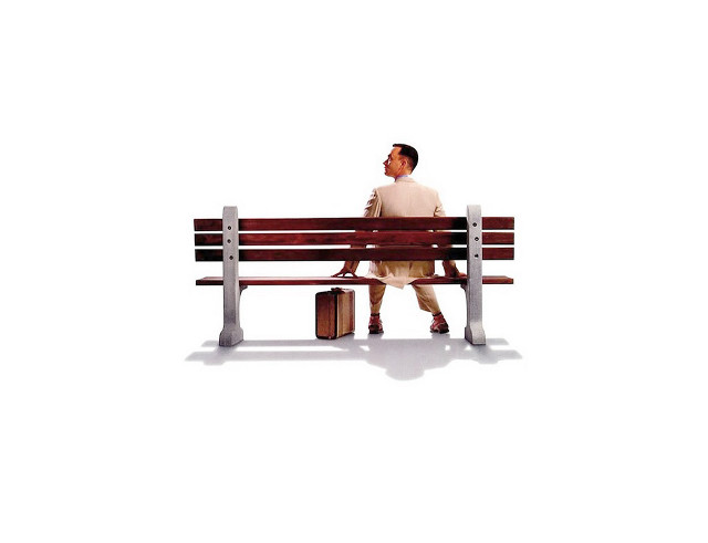 Man sitting bench suitcase hand free wallpaper - medium preview image