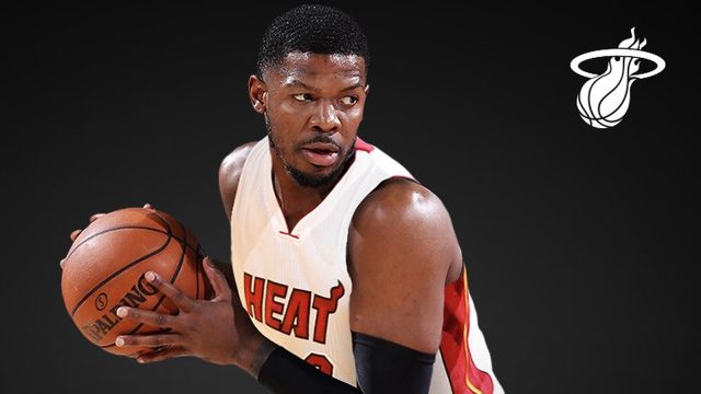 Man holding basketball heat logo free wallpaper - medium preview image