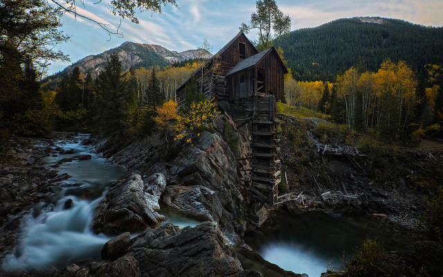Wooden building rocky hillside river #2 free wallpaper - medium preview image