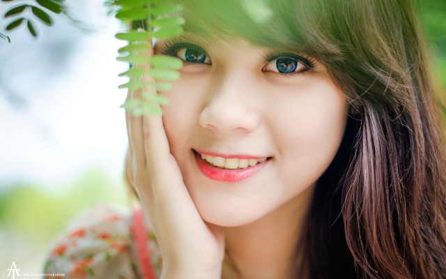 Woman blue eyes green leaf free wallpaper - medium preview image