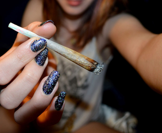 Woman cigarette lighter manicure blue free wallpaper - medium preview image