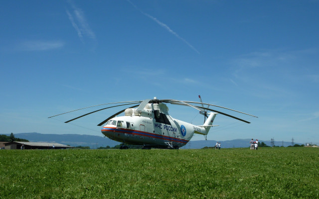 Helicopter lush green field forest free wallpaper - medium preview image