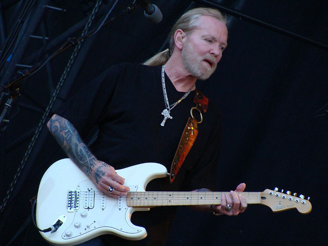 Bearded man playing white guitar free wallpaper - medium preview image